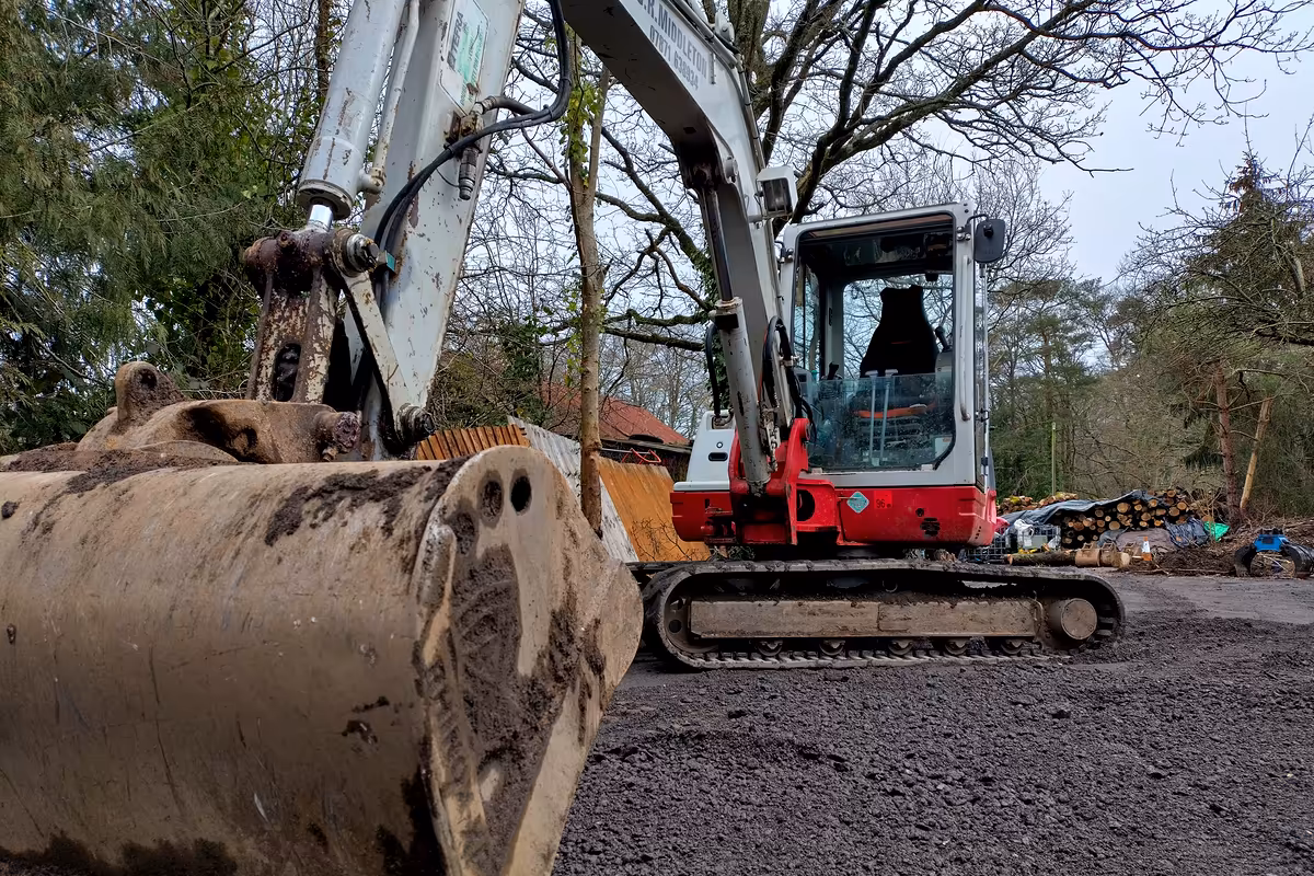 Excavator forming a hard standing