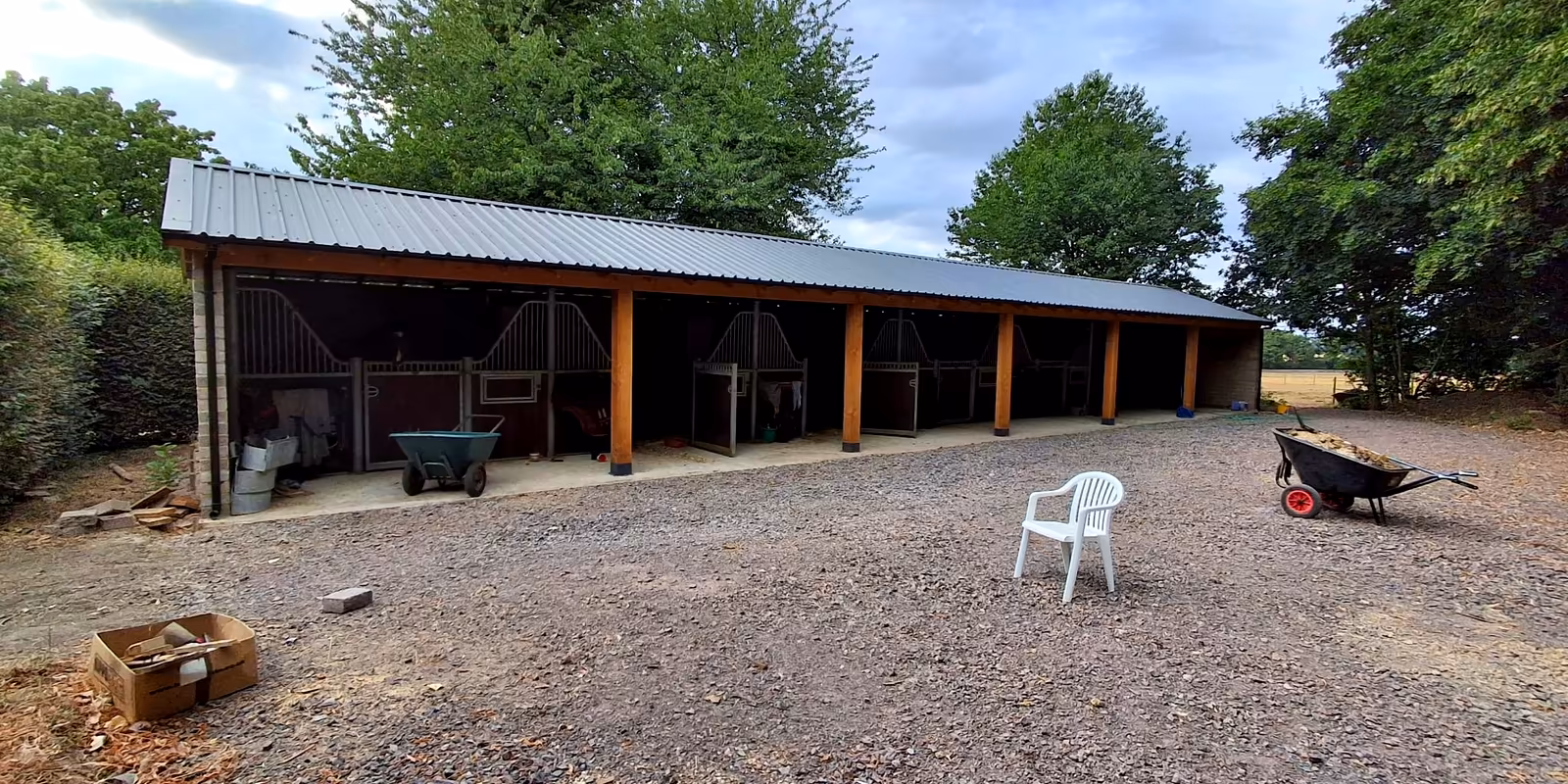 Stable block standing on its new base and stone yard